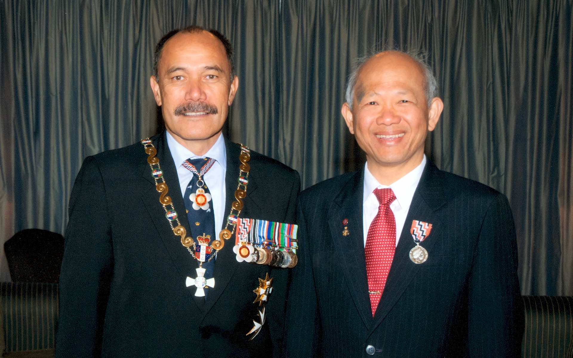 Kuan Yap (right) with the Governor-General of New Zealand at his Queen's Service Medal ceremony